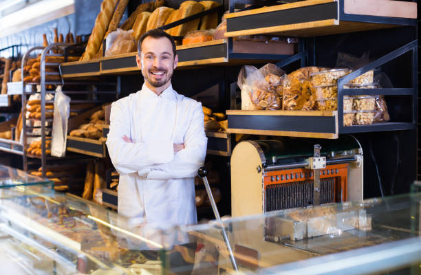 istock Positive male pastry maker demonstrating pastry 1167985695