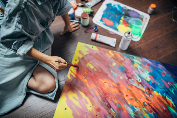 istock Creative woman painting in her studio 1167986123