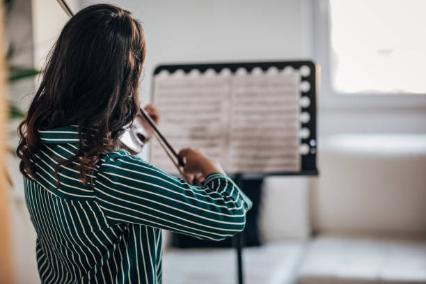 istock Beautiful Violinist Woman 1167986202