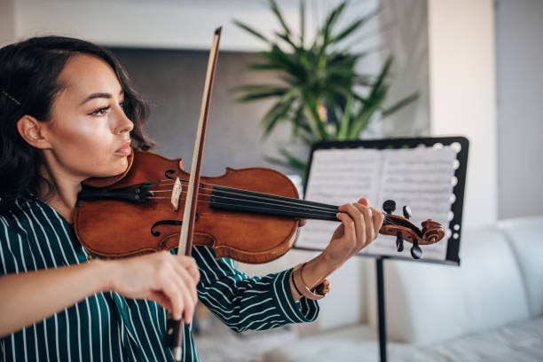 istock Beautiful Violinist Woman 1167987284