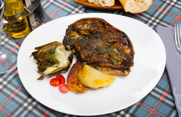 istock Spanish dish - lamb head with artichoke, tomatoes and potatoes 1167987489