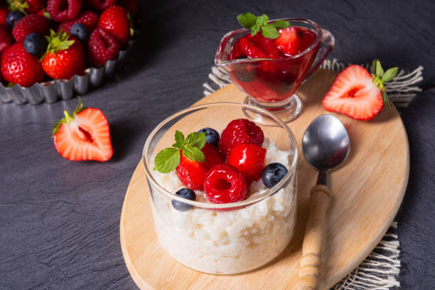 istock delicious milk rice with different berries and red fruit jelly 1167988690