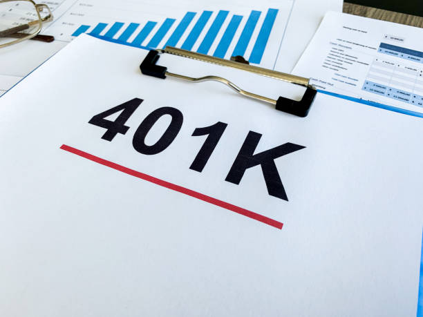 istock Paper with 401k plan on wood table. 1167989093