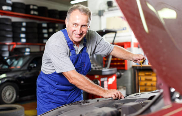istock Mechanic engaged in replacement of engine oil 1167989171