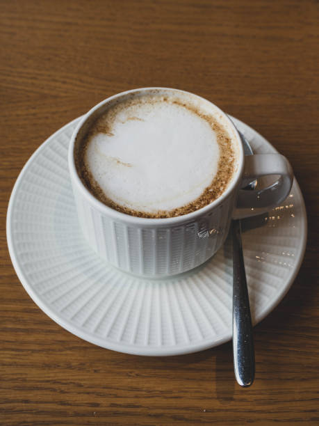 istock A coffee, flat white cappuccino or latte, in a cafe in a white mug 1167991544