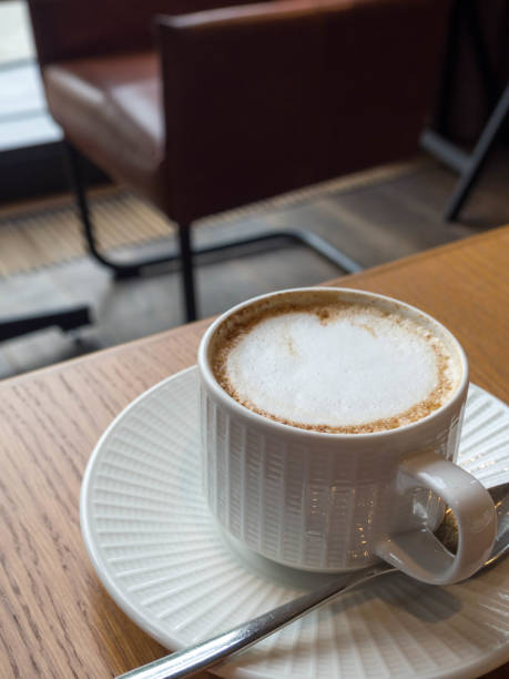 istock Cup of coffee latte on wood bar 1167991680