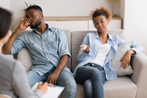 istock Indifferent Black Spouses Sitting On Sofa At Couples Therapist's Office 1167992599