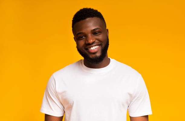 istock Young smiling african american man over yellow background 1167992604