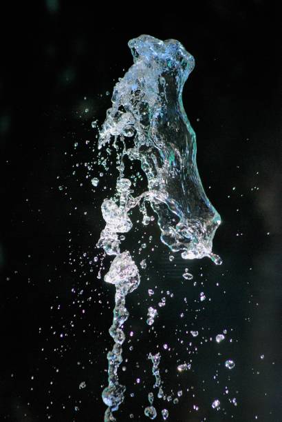 istock splashing water on dark background, shapes 1167995309