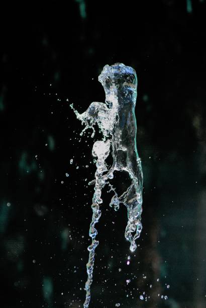 istock splashing water on dark background, shapes 1167995323