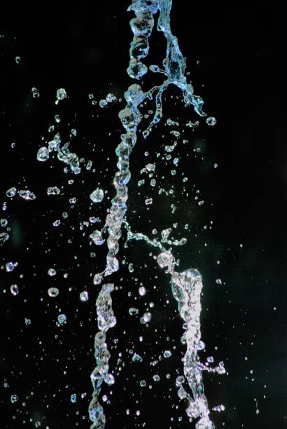istock splashing water on dark background, shapes 1167995341