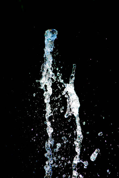 istock splashing water on dark background, shapes 1167995584