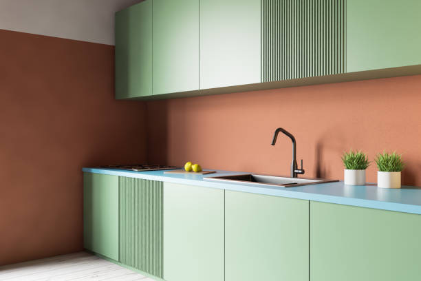 istock Orange kitchen with green countertops 1167996487