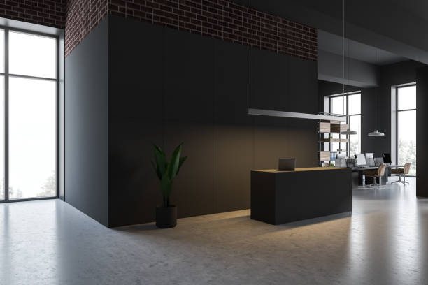 istock Gray reception desk in gray open space office 1167998520