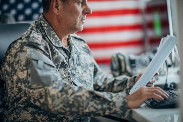 istock Army soldier working ona clasified document 1167998813