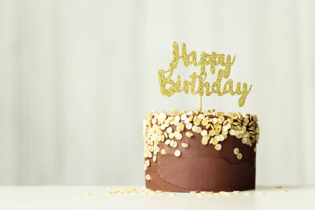 istock Chocolate and gold birthday cake 1167998948