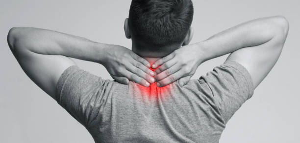 istock Young man massaging inflamed neck, back view 1168001639