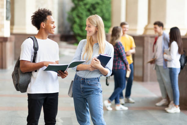 istock Teen friends preparing for lecture in university campus 1168001830