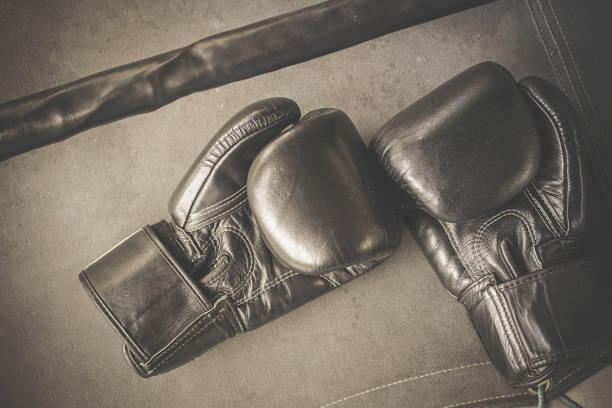 istock Black practise boxing gloves in the boxing gym 1168002364