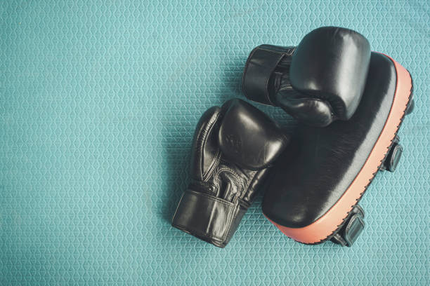 istock Black practise boxing gloves in the boxing gym 1168002435