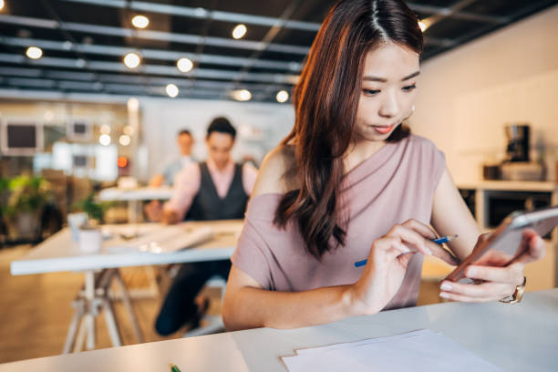 istock Woman in modern office 1168004305