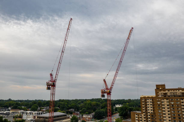 Develop Via Craning Machines Various cranes dispersed across the city, all being used to create multiple structures in a developing urban sprawl towson photos stock pictures, royalty-free photos & images