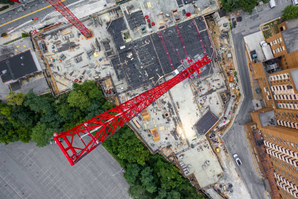 Develop Via Craning Machines Various cranes dispersed across the city, all being used to create multiple structures in a developing urban sprawl towson photos stock pictures, royalty-free photos & images