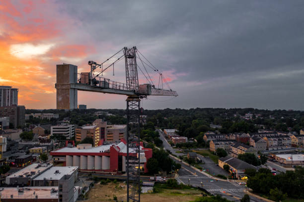 Develop Via Craning Machines Various cranes dispersed across the city, all being used to create multiple structures in a developing urban sprawl towson photos stock pictures, royalty-free photos & images