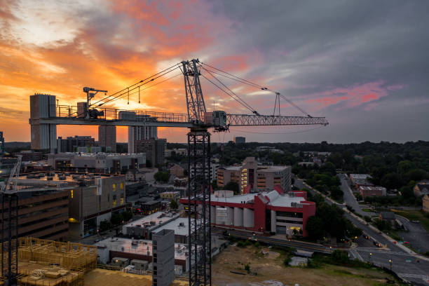 Develop Via Craning Machines Various cranes dispersed across the city, all being used to create multiple structures in a developing urban sprawl towson photos stock pictures, royalty-free photos & images