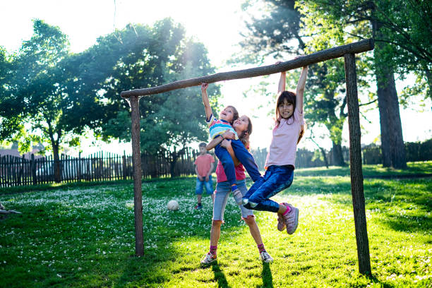istock Happy children playing in park 1168008009