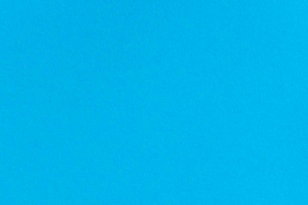 istock Blue color paper background. Empty space on monochrome cardboard 1168010410