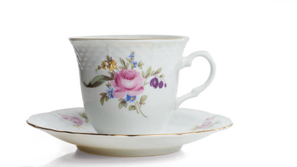 istock Porcelain white cup on a saucer with gilding. 1168010889