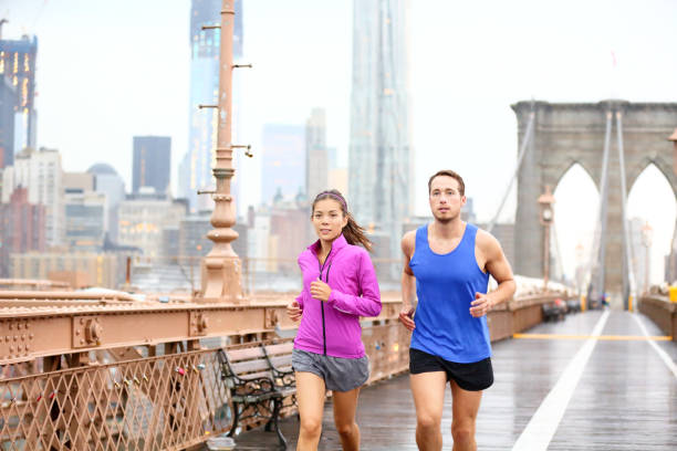 istock Runners couple running in New York 1168012589