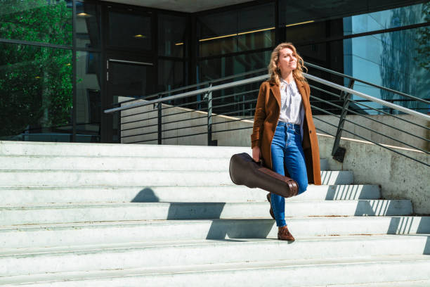 istock Girl with violin came down stairs after lessons 1168014007