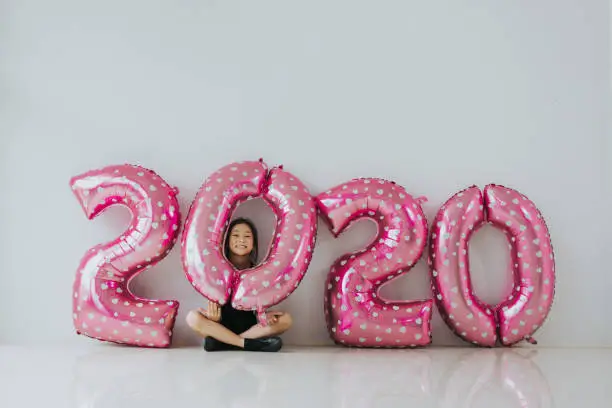 Photo of 2020 new year balloon with cute girl