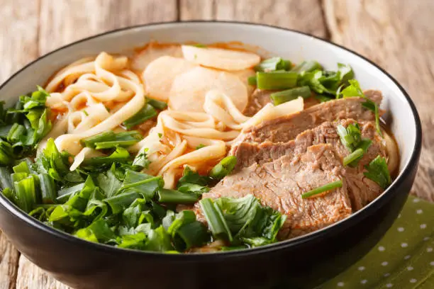 Easy Recipe for Lanzhou Beef Noodle Soup closeup in a bowl on the table. horizontal