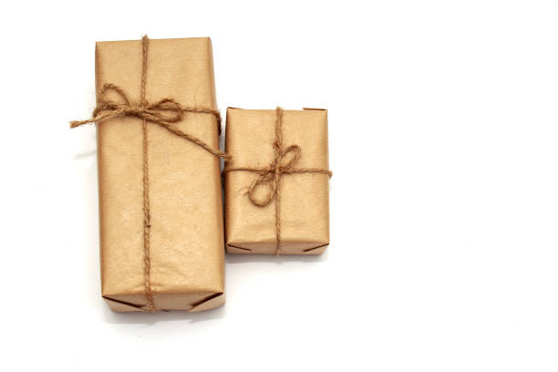 istock Two gift boxes in craft paper isolated on white background 1168028134