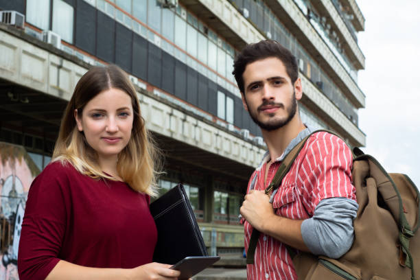 istock Two University students studying together outdoors 1168028578