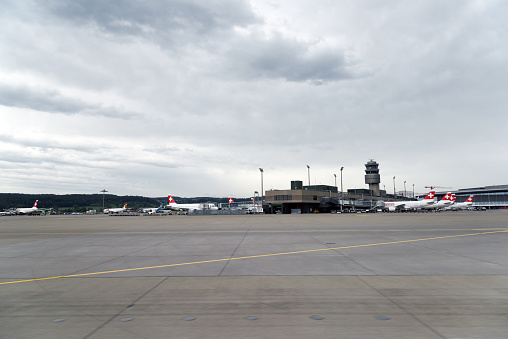 The Zurich Airport (ZRH) with its airfield. The Image was captured during summer season at a cloudy day,