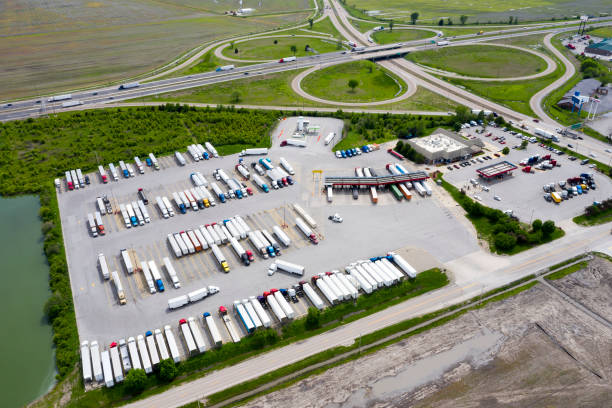 Highway and Truck Stop full of Semi Trucks, Aerial View, USA stock photo