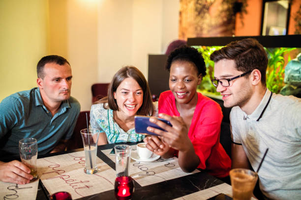 istock Friends Enjoying In Restaurant 1168032060