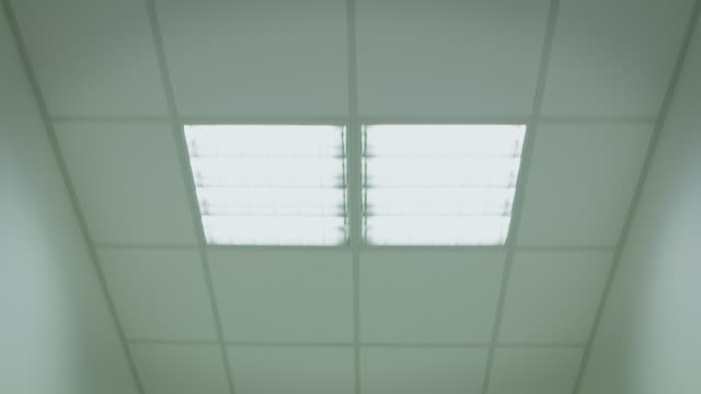 POV shot of illuminated ceiling in hospital