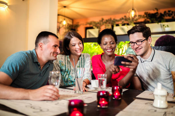 istock Friends Enjoying In Restaurant 1168033153