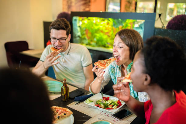 istock Friends Enjoying In Restaurant 1168033783