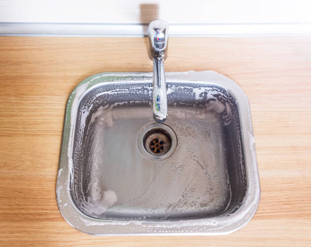 istock Stainless steel metal kitchen sink with foam cleaner. 1168033872