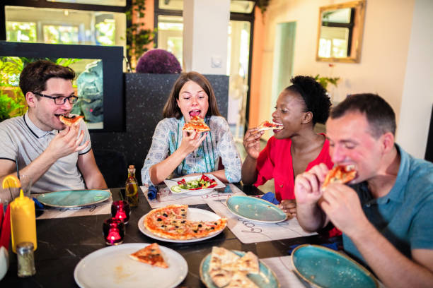 istock Friends Enjoying In Restaurant 1168033889