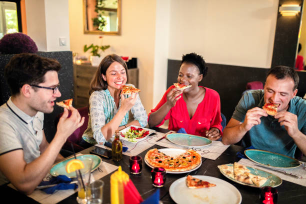 istock Friends Enjoying In Restaurant 1168033902