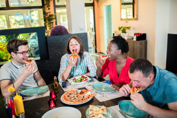 istock Friends Enjoying In Restaurant 1168033959