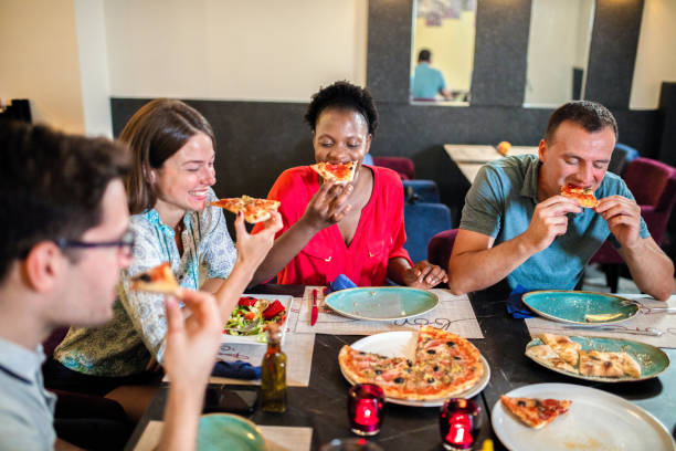 istock Friends Enjoying In Restaurant 1168034048
