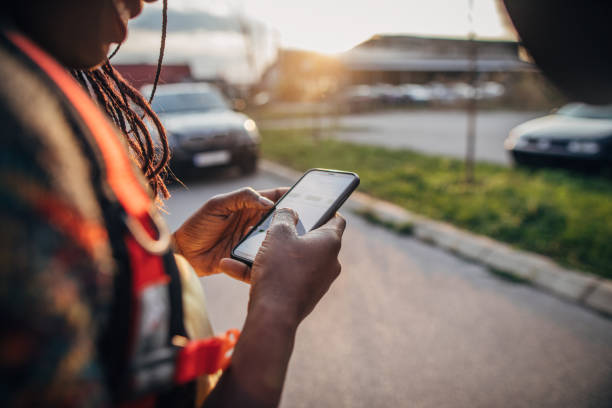 istock African-American woman with backpack hitchhiking 1168034872